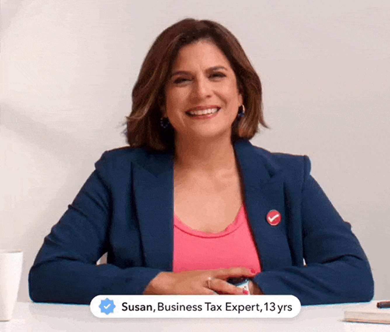 Business tax expert seated at desk in studio